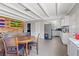 Open-concept kitchen and living area with modern appliances, beam ceilings, and lots of natural light at 2528 Sunrise Ave, Las Vegas, NV 89101