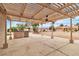 Outdoor kitchen with stainless grill and covered patio area, perfect for entertaining at 2532 Big Timber Dr, Las Vegas, NV 89134