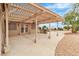 Covered back patio includes a built-in grill and ample seating space, perfect for outdoor dining at 2532 Big Timber Dr, Las Vegas, NV 89134