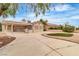 Expansive backyard featuring a covered patio, built-in grill, and drought-tolerant landscaping at 2532 Big Timber Dr, Las Vegas, NV 89134