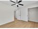 A spacious bedroom features wood flooring, a modern ceiling fan, and closet at 2532 Big Timber Dr, Las Vegas, NV 89134