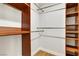 Walk-in closet offers wood shelving and ample storage space at 2532 Big Timber Dr, Las Vegas, NV 89134