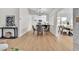Open-concept dining room featuring hardwood floors, contemporary lighting, and lots of natural light at 2532 Big Timber Dr, Las Vegas, NV 89134
