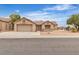 Street view of the home's front exterior featuring desert landscaping and a 2-car garage at 2532 Big Timber Dr, Las Vegas, NV 89134