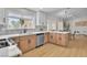 Bright, modern kitchen featuring wood cabinets, stainless steel appliances, and a large window overlooking the yard at 2532 Big Timber Dr, Las Vegas, NV 89134