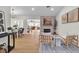 Bright living room featuring modern decor, a fireplace, and hardwood floors throughout at 2532 Big Timber Dr, Las Vegas, NV 89134