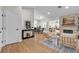 Spacious living room with a fireplace, modern decor, and hardwood floors throughout at 2532 Big Timber Dr, Las Vegas, NV 89134