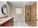 Updated bathroom showcasing dual sinks, granite counters, and a tile and glass shower at 2851 S Valley View Blvd # 1039, Las Vegas, NV 89102