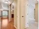 Neutral hallway featuring white tile flooring, neutral paint, and a closet at 2851 S Valley View Blvd # 1039, Las Vegas, NV 89102
