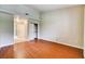 Bedroom with wood floors, neutral walls, open closet and an adjoining bathroom at 2851 S Valley View Blvd # 1039, Las Vegas, NV 89102