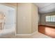 Entryway leading to the bedroom with hardwood floors and a view of the kitchen at 2851 S Valley View Blvd # 1039, Las Vegas, NV 89102