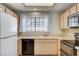 Well-lit kitchen featuring a large window, neutral countertops, and appliances at 2851 S Valley View Blvd # 1039, Las Vegas, NV 89102
