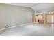 Bright, open-concept living room with tile floors, high ceilings, and a glimpse of the kitchen at 2851 S Valley View Blvd # 1039, Las Vegas, NV 89102