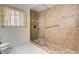 Updated bathroom showcasing tile and glass shower with handrails and seat at 2851 S Valley View Blvd # 1039, Las Vegas, NV 89102