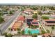 Overhead view of a home showcasing a large pool, spa, solar panels, and lush landscaping in a suburban setting at 301 E Longacres Dr, Henderson, NV 89015