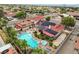 High-angle view of a home with a swimming pool, spa, solar panels, and beautifully landscaped backyard at 301 E Longacres Dr, Henderson, NV 89015