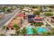 Drone shot of a house with a pool, spa, solar panels, and well-manicured landscaping in a residential area at 301 E Longacres Dr, Henderson, NV 89015