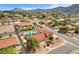 Expansive aerial view of the property with a pool, solar panels and mountain views at 301 E Longacres Dr, Henderson, NV 89015