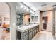 Updated bathroom with double sinks, modern fixtures, and a stand-alone shower at 301 E Longacres Dr, Henderson, NV 89015