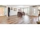 Bright dining room with hardwood floors and large windows providing lots of natural light at 301 E Longacres Dr, Henderson, NV 89015