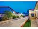 Exterior view of the driveway, and block wall providing privacy at 301 E Longacres Dr, Henderson, NV 89015