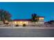 Charming single-story home featuring a desert landscaped front yard with a covered porch at 301 E Longacres Dr, Henderson, NV 89015
