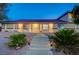 Well-maintained exterior featuring desert landscaping and inviting walkway at 301 E Longacres Dr, Henderson, NV 89015