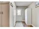 Bright and airy hallway with wood floors and plenty of storage space at 301 E Longacres Dr, Henderson, NV 89015