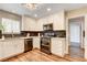 Well-lit kitchen featuring stainless steel appliances and white cabinets and modern finishes at 301 E Longacres Dr, Henderson, NV 89015