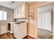 Functional laundry room featuring a washer, dryer and extra storage at 301 E Longacres Dr, Henderson, NV 89015