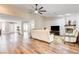 Open-concept living area with hardwood floors, fireplace, and lots of natural light at 301 E Longacres Dr, Henderson, NV 89015
