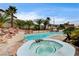 Inviting backyard pool and spa surrounded by lush landscaping and a covered gazebo perfect for outdoor relaxation at 301 E Longacres Dr, Henderson, NV 89015