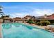 Beautiful pool area with a clear blue pool and a charming gazebo, set against the backdrop of the home at 301 E Longacres Dr, Henderson, NV 89015