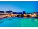 Sparkling pool with covered outdoor living and desert landscaping at 301 E Longacres Dr, Henderson, NV 89015