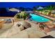 A lush backyard and swimming pool provides plenty of space for outdoor gatherings and leisure at 301 E Longacres Dr, Henderson, NV 89015