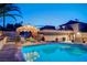 Private swimming pool with a shaded pergola featuring patio furniture, creating a backyard retreat at 301 E Longacres Dr, Henderson, NV 89015