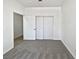 Well-lit bedroom offering carpet flooring, closet space, and easy access to other rooms at 3109 W Colton Ave, North Las Vegas, NV 89032