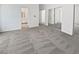 Spacious bedroom featuring a large carpeted area, closet, and bathroom entrance at 3109 W Colton Ave, North Las Vegas, NV 89032