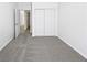 Bright bedroom with carpet, double sliding door closet, and white walls at 3109 W Colton Ave, North Las Vegas, NV 89032