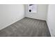 Bright bedroom offering neutral carpet, white walls, and natural light from the window at 3109 W Colton Ave, North Las Vegas, NV 89032