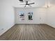 Bright living room with modern flooring, neutral colors, and natural light from the windows at 3109 W Colton Ave, North Las Vegas, NV 89032