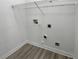 Utility room featuring modern vinyl flooring and a wire rack for storage at 3109 W Colton Ave, North Las Vegas, NV 89032