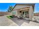 The house has a covered patio, small grass area, and a brick-paved area with various seating arrangements at 3307 Forestina Ct, Las Vegas, NV 89122