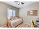 Bedroom with wood look vinyl flooring, ceiling fan, natural light and space for work or play at 3307 Forestina Ct, Las Vegas, NV 89122