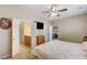 Inviting bedroom with ceiling fan and access to an ensuite bathroom and view to the living area at 3307 Forestina Ct, Las Vegas, NV 89122