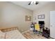 Bedroom with ceiling fan, natural light, workspace and space for a bed or couch at 3307 Forestina Ct, Las Vegas, NV 89122
