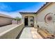 Inviting front porch with tiled walkway, seating area, and decorative sunburst art at 3307 Forestina Ct, Las Vegas, NV 89122