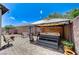 Backyard featuring a covered hot tub with bar seating, surrounded by brick paving and decorative elements at 3307 Forestina Ct, Las Vegas, NV 89122