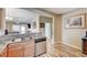 Open kitchen featuring granite countertops, stainless steel appliances, and seamless flow into the living area at 3307 Forestina Ct, Las Vegas, NV 89122