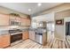 Updated kitchen with granite countertops, stainless steel appliances, and wood-look flooring at 3307 Forestina Ct, Las Vegas, NV 89122